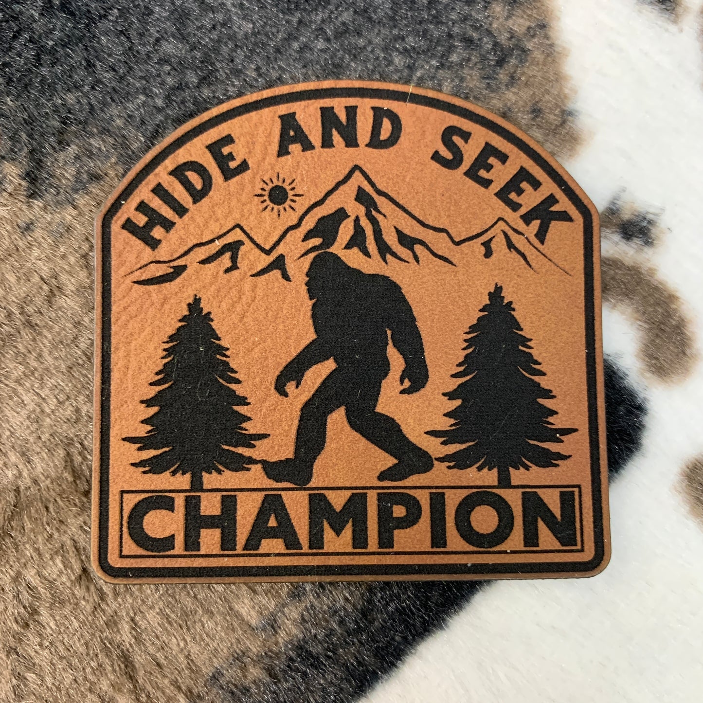 Hide and Seek Champion - 2.5" wide x 2.4" tall Leatherette Patch