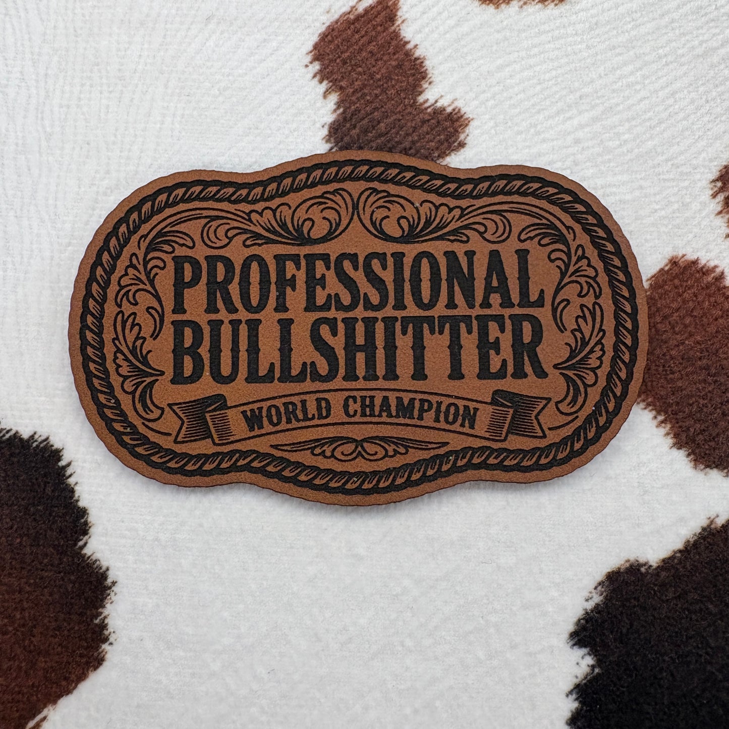 Professional Bullsh!tter World Champion Rope Buckle- 3.25” wide x 2” tall Leatherette Patch