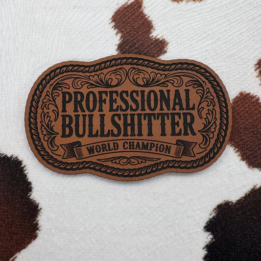 Professional Bullsh!tter World Champion Rope Buckle- 3.25” wide x 2” tall Leatherette Patch