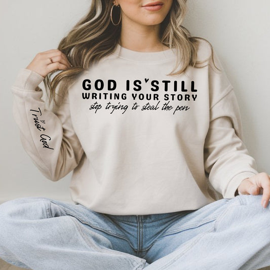 **PREORDER** God is Still Writing Your Story, Stop Trying to Steal the Pen WITH Trust God sleeve- Single Color (black)- 11.5" Screen Print Transfer