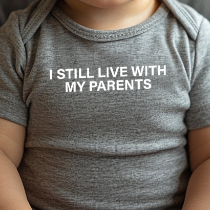I Still Live With My Parents (infant)-Single Color (white)- 4.25” wide Single Color Transfer