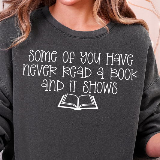 **PREORDER** Some of You Have Never Read a Book and It Shows- Single Color (white)- 11.5” wide Screen Print Transfer
